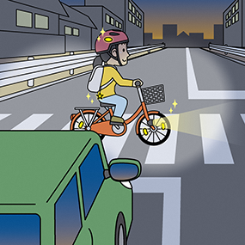 夜光反射材を身に着け走行する自転車
